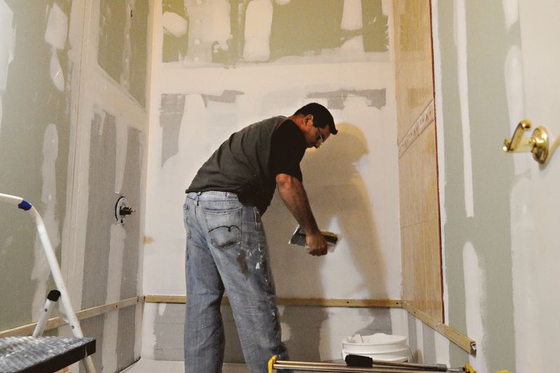 a man working on a remodeling project